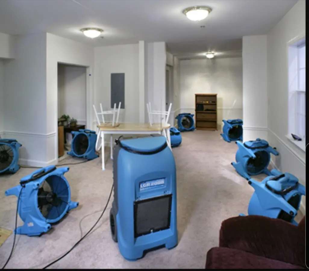 Air movers and dehumidifier setup for Water Damage Restoration in Hollis